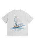 White t-shirt with sailboat graphic and text on a white background